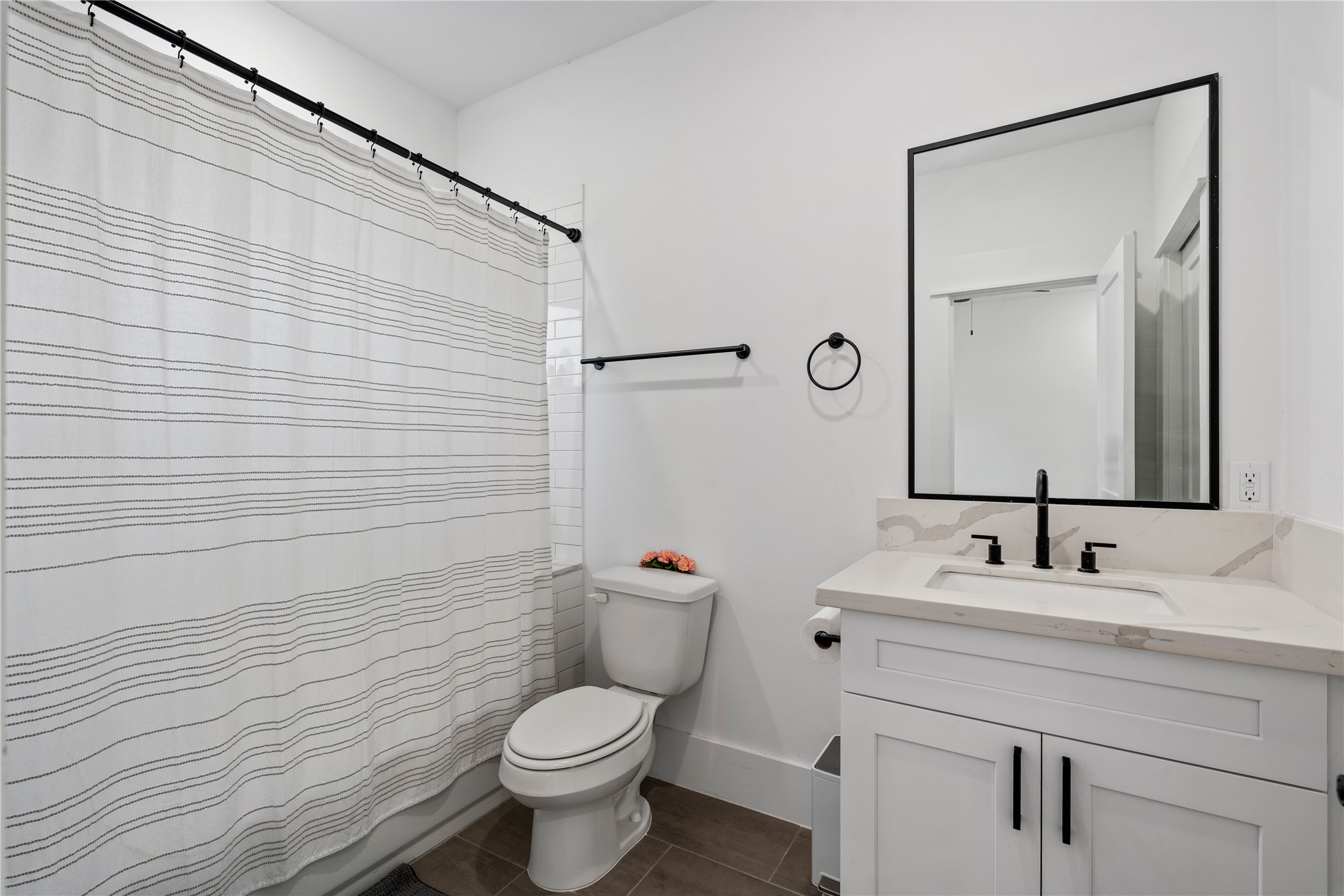 1835 Flowing Springs Trail Houston, TX 77080 - Photo 4 of 25 a bathroom with a toilet sink vanity and mirror