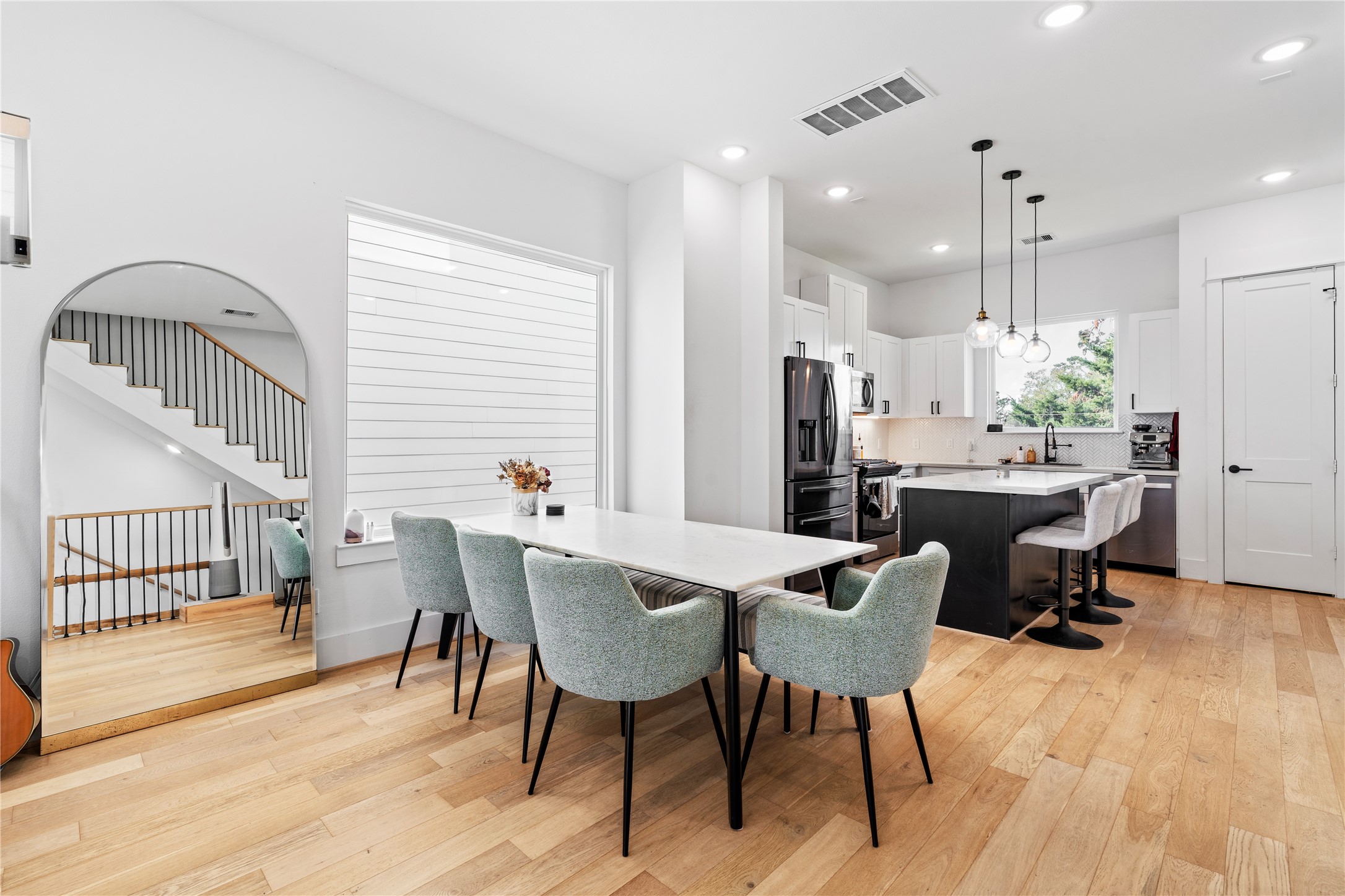 1835 Flowing Springs Trail Houston, TX 77080 - Photo 9 of 25 a view of a dining room with furniture and wooden floor