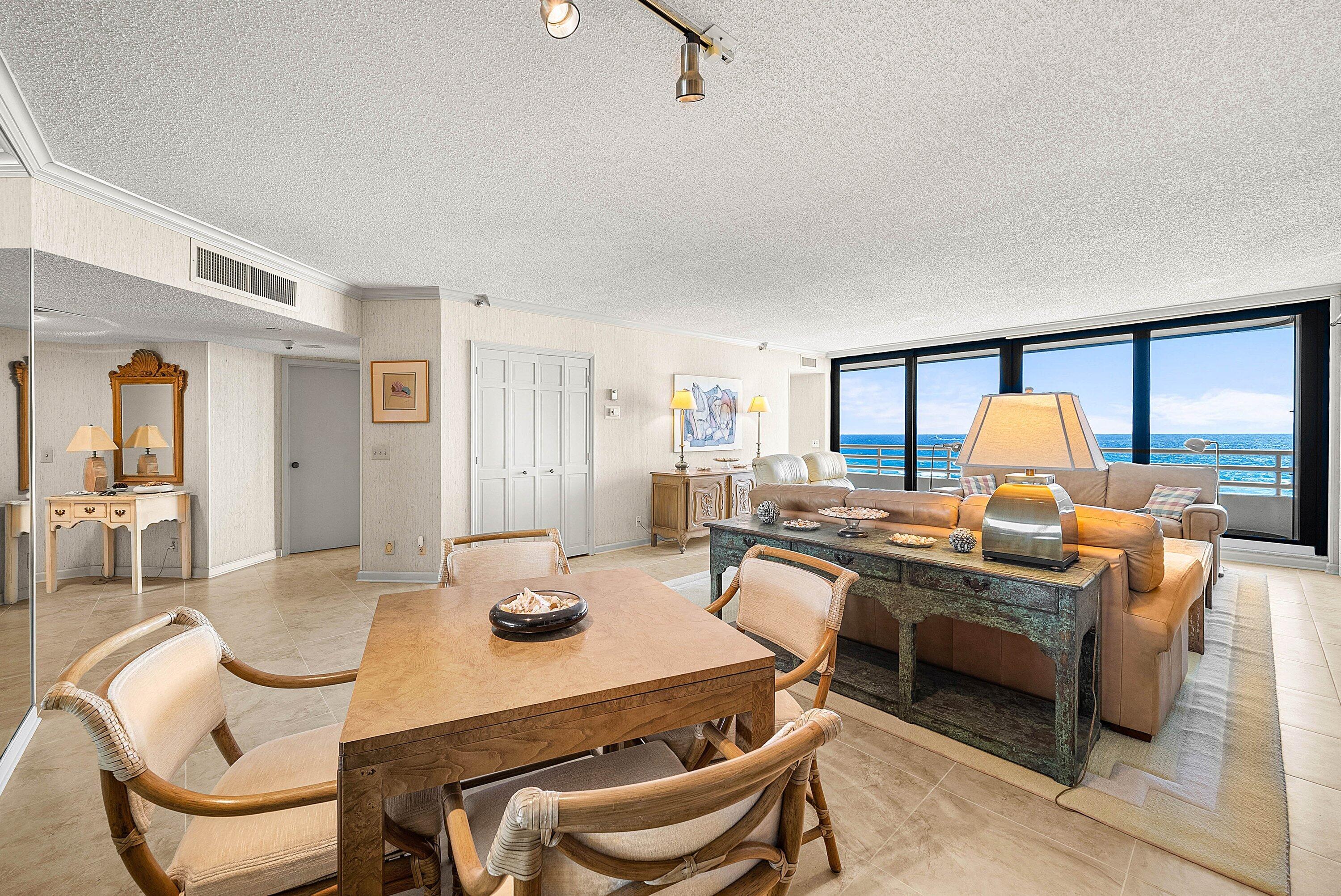 1500 South Ocean Boulevard, Unit 604 Boca Raton, FL 33432 - Photo 11 of 61 a dining room with furniture and wooden floor
