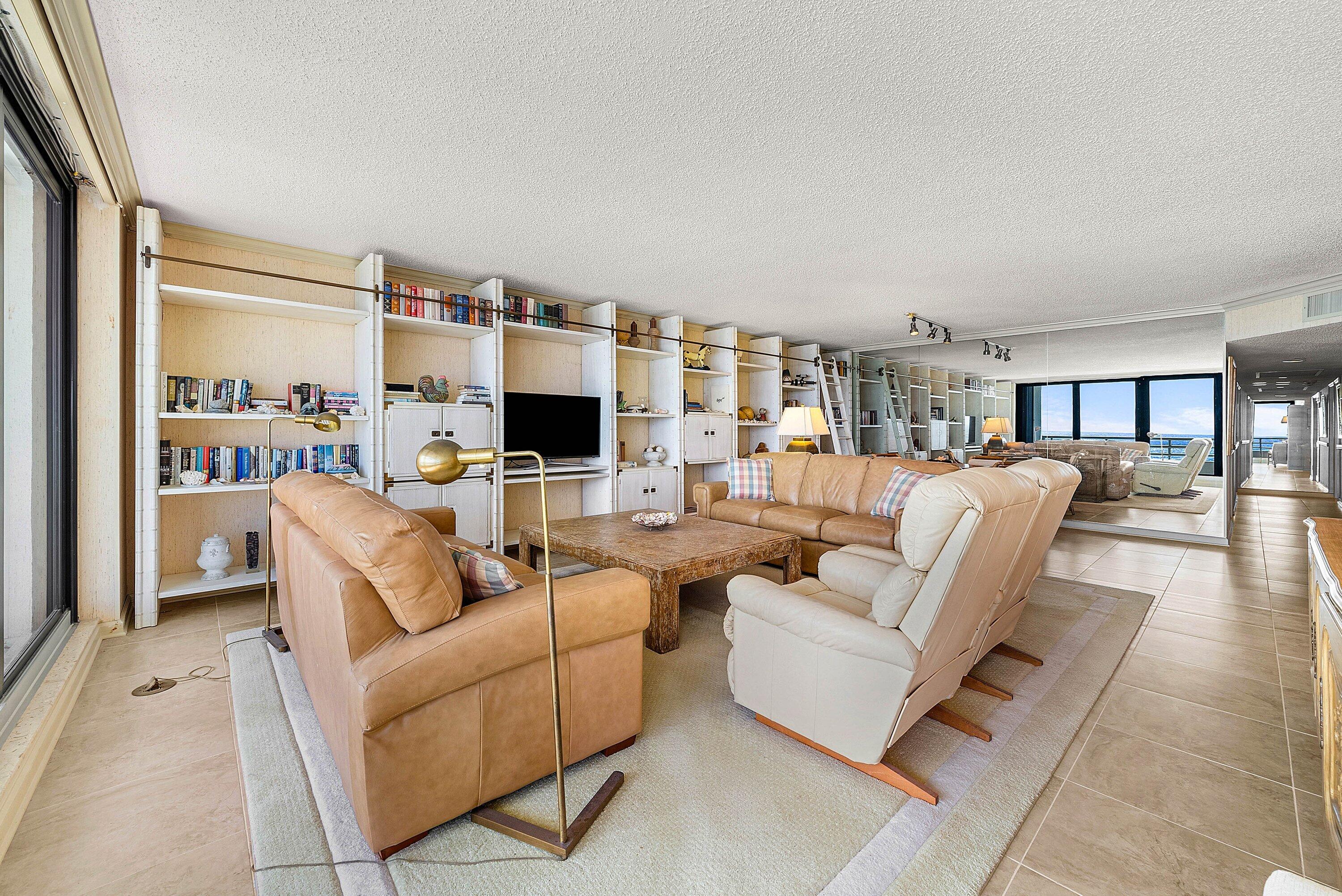 1500 South Ocean Boulevard, Unit 604 Boca Raton, FL 33432 - Photo 13 of 61 a living room with furniture and a flat screen tv