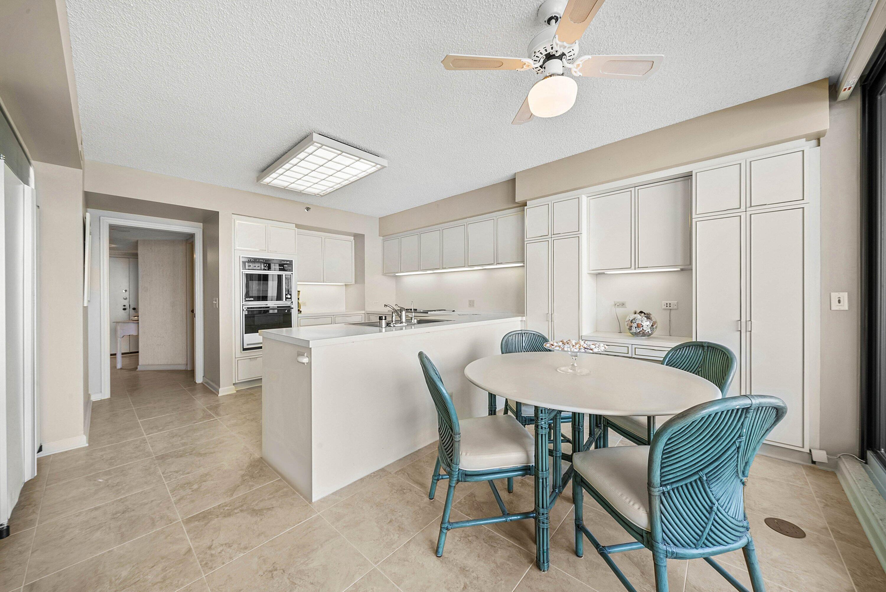 1500 South Ocean Boulevard, Unit 604 Boca Raton, FL 33432 - Photo 19 of 61 a view of a dining room with furniture and a chandelier