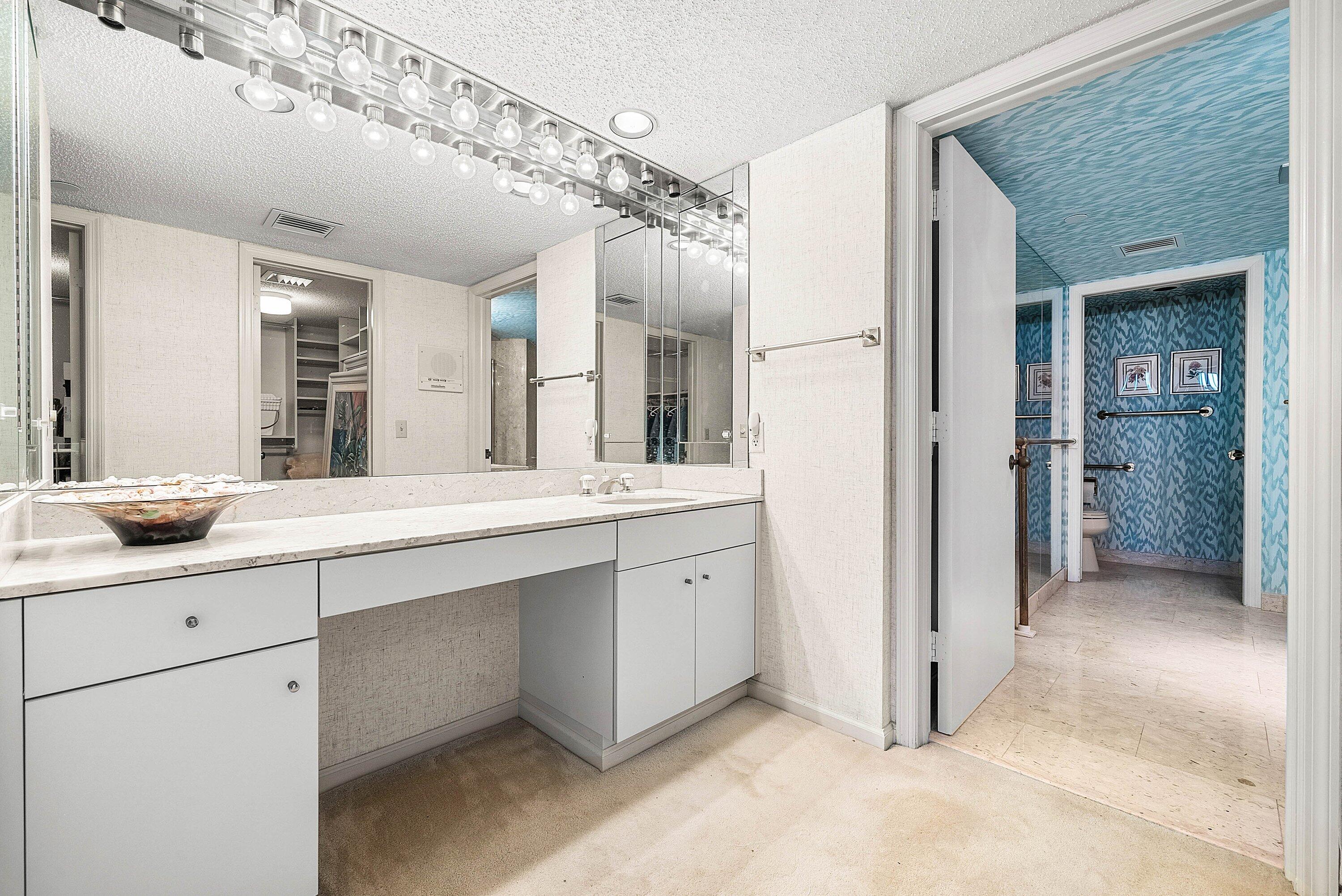 1500 South Ocean Boulevard, Unit 604 Boca Raton, FL 33432 - Photo 24 of 61 a spacious bathroom with a double vanity sink a mirror and shower