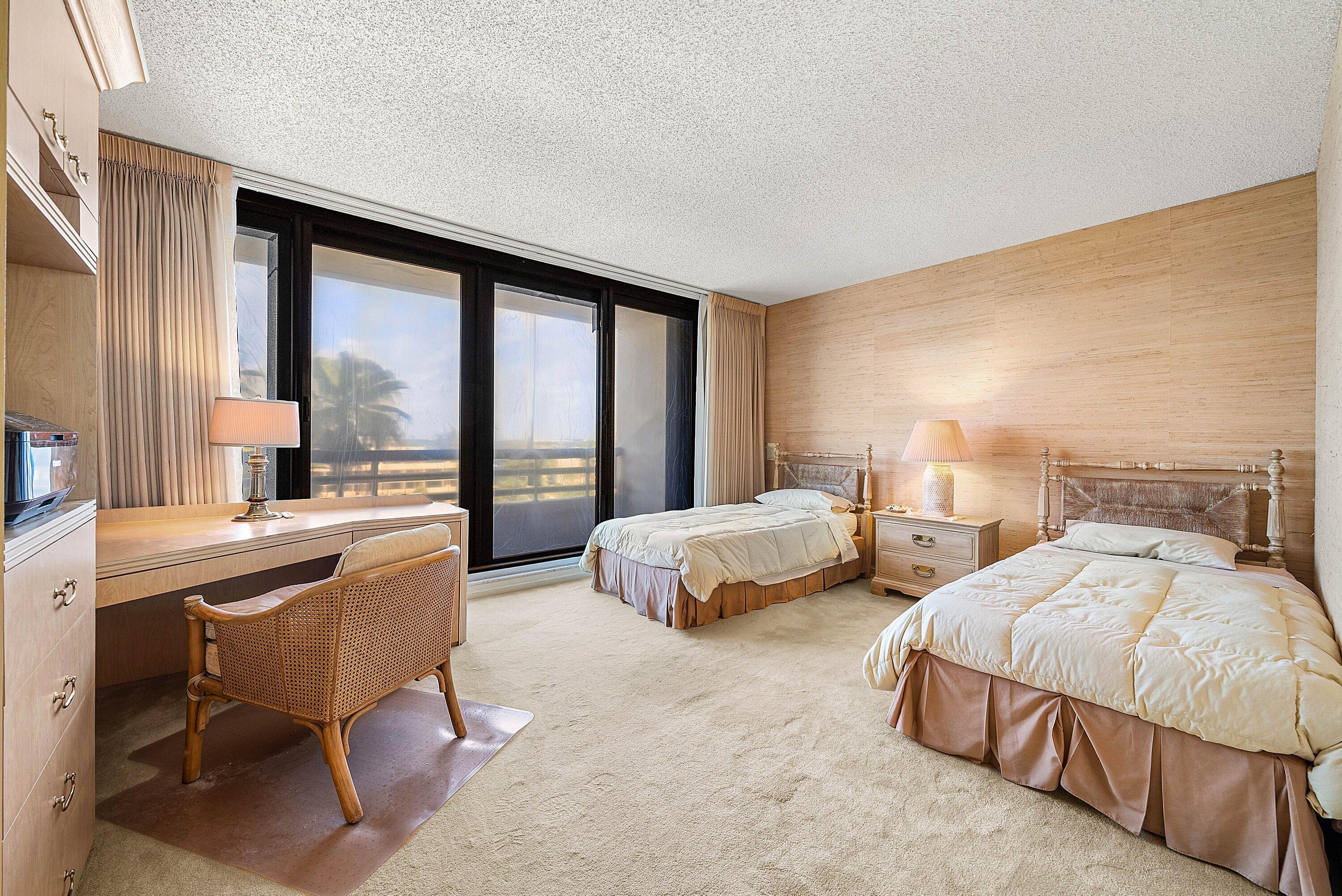 1500 South Ocean Boulevard, Unit 604 Boca Raton, FL 33432 - Photo 27 of 61 a spacious bedroom with two beds and large window