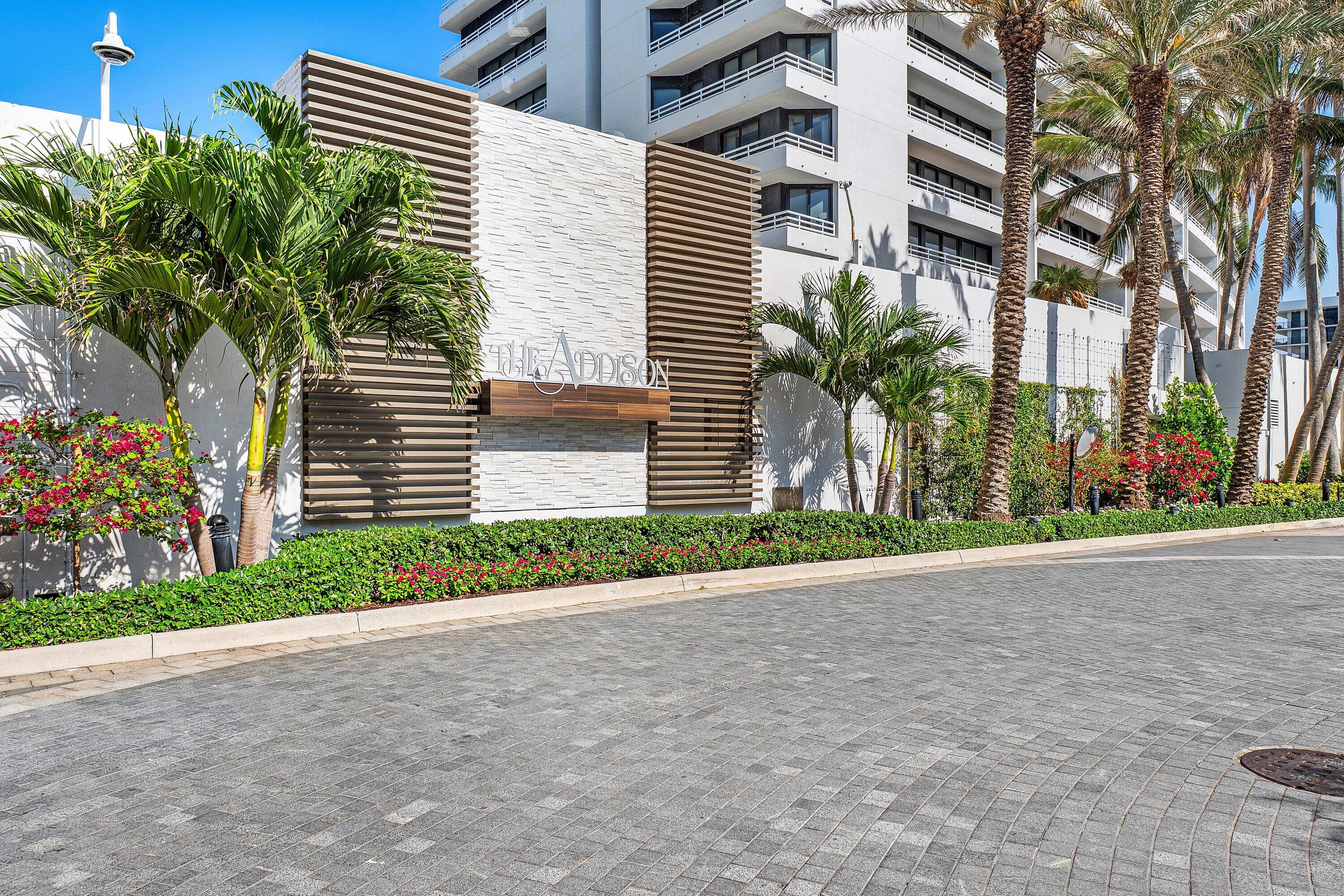 1500 South Ocean Boulevard, Unit 604 Boca Raton, FL 33432 - Photo 33 of 61 a front view of a house with a yard and a garage