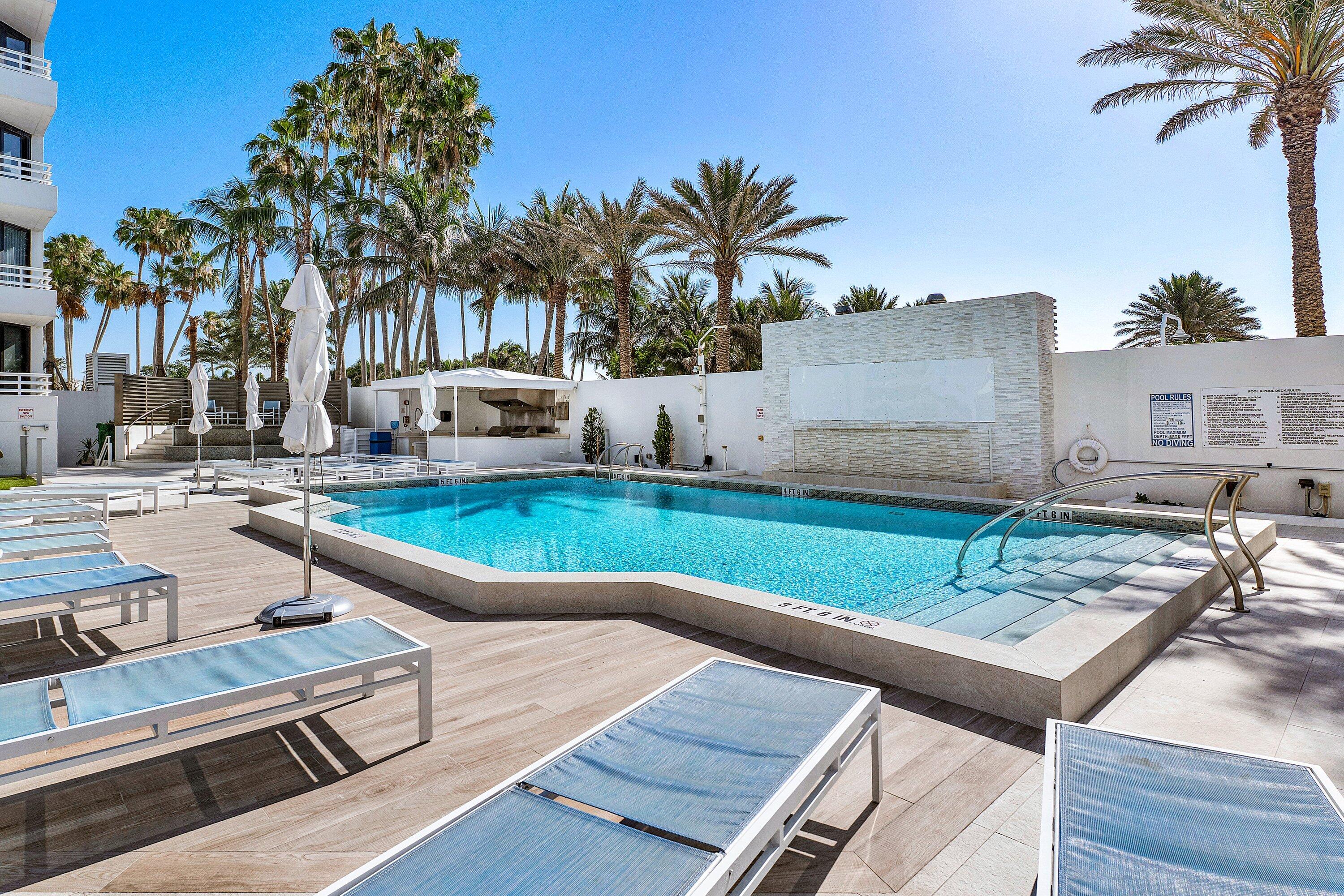 1500 South Ocean Boulevard, Unit 604 Boca Raton, FL 33432 - Photo 44 of 61 a view of a house with pool and chairs