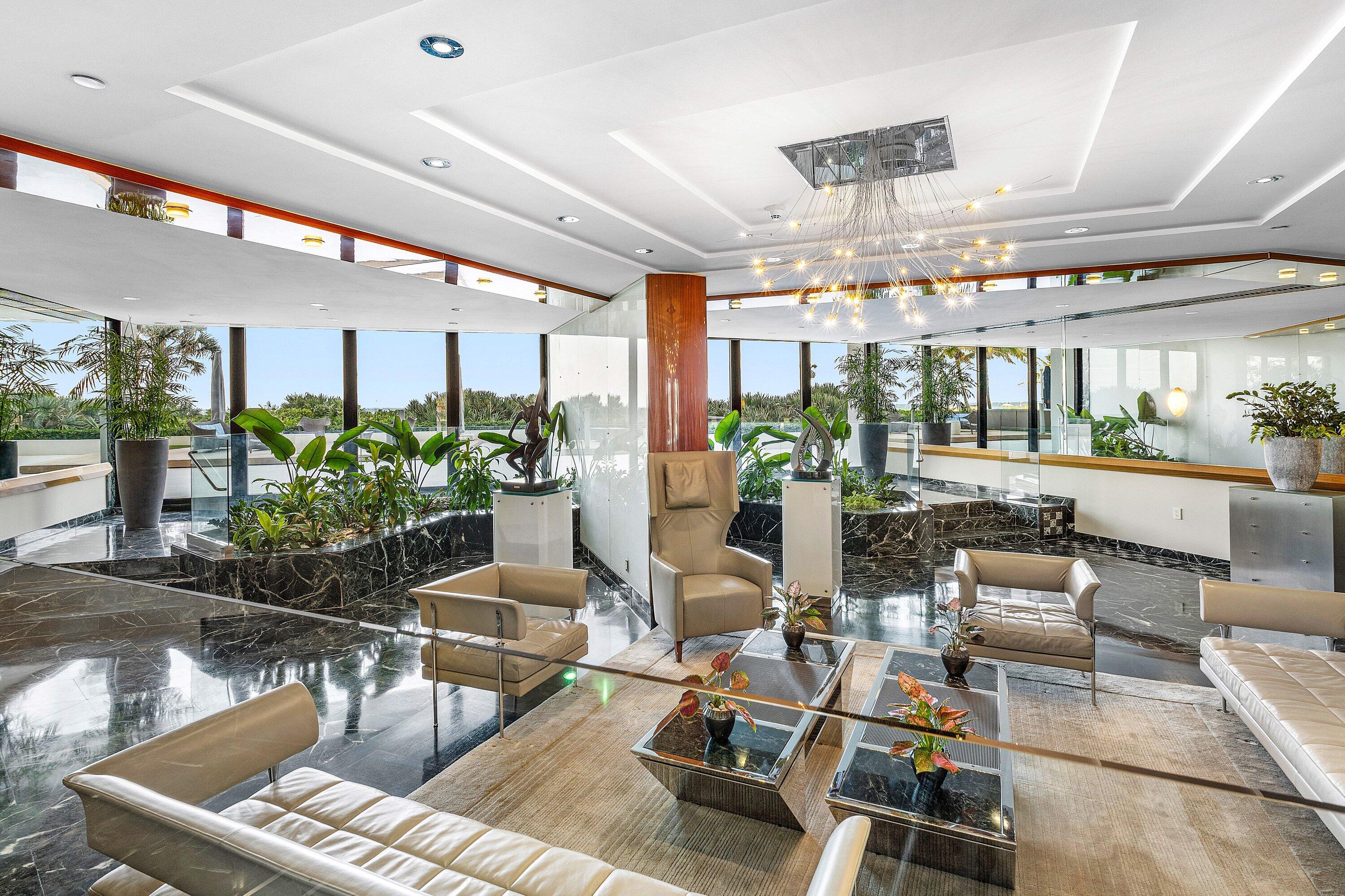 1500 South Ocean Boulevard, Unit 604 Boca Raton, FL 33432 - Photo 48 of 61 a living room with furniture and a potted plant