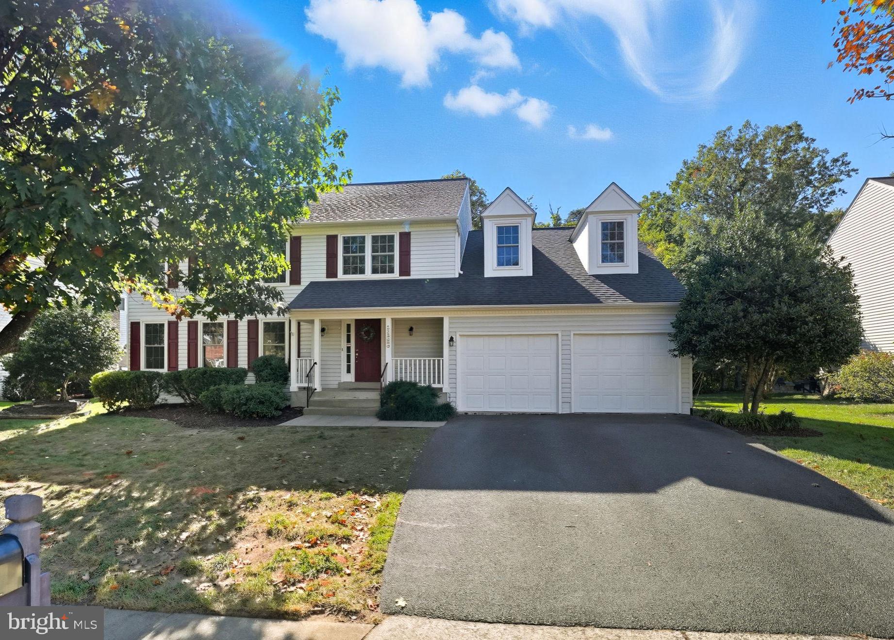 21507 Tithables Circle Broadlands, VA 20148 - Photo 2 of 64 a front view of a house with a yard and garage