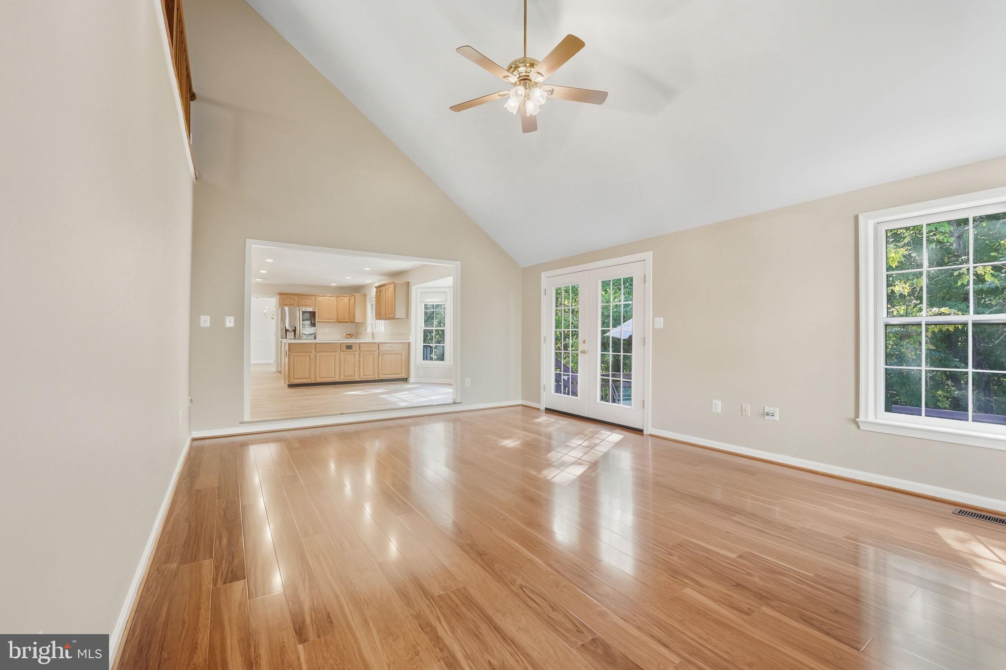 21507 Tithables Circle Broadlands, VA 20148 - Photo 22 of 64 a view of an empty room with a window and wooden floor