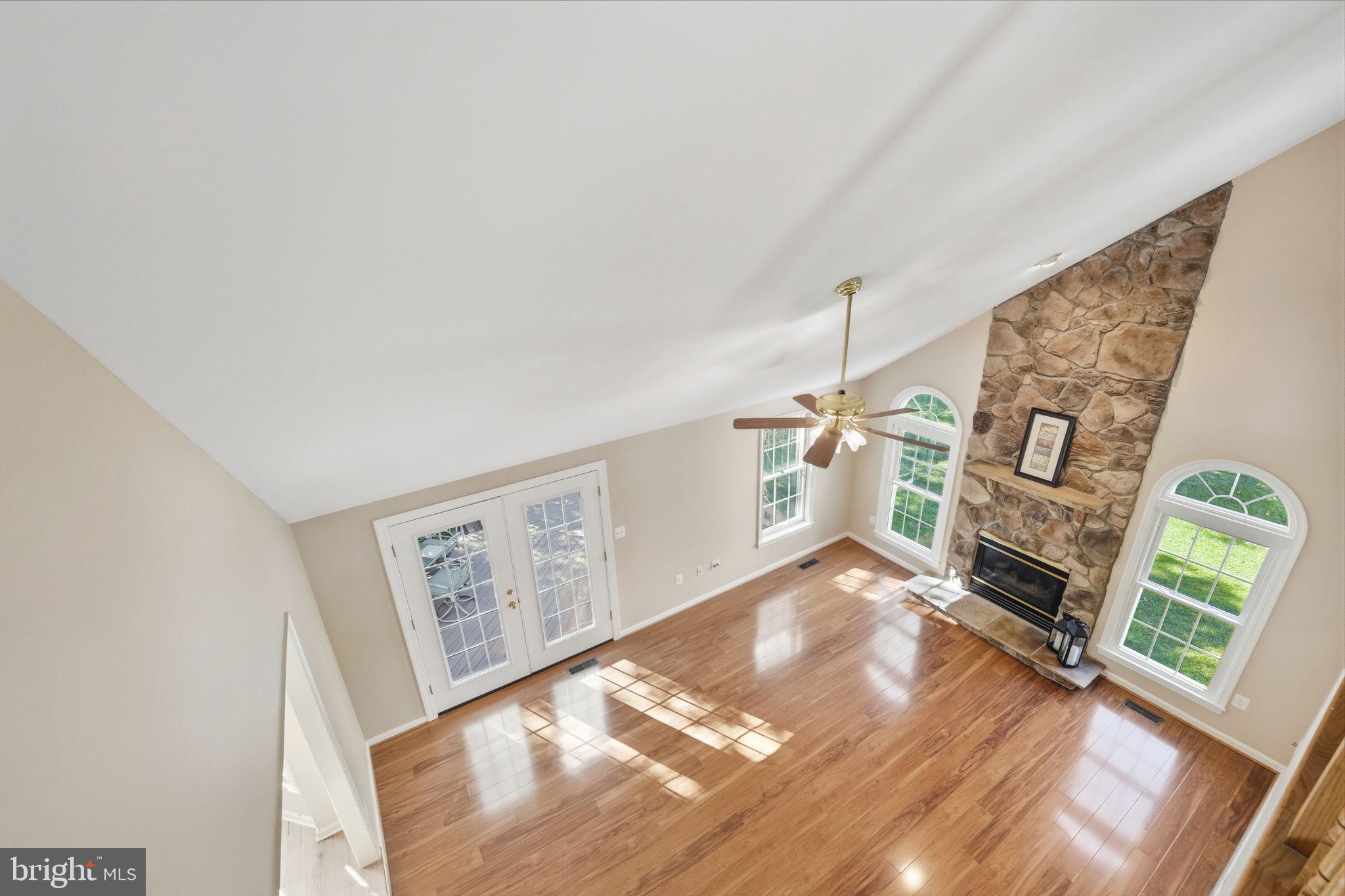 21507 Tithables Circle Broadlands, VA 20148 - Photo 27 of 64 a view of an empty room with window and fireplace