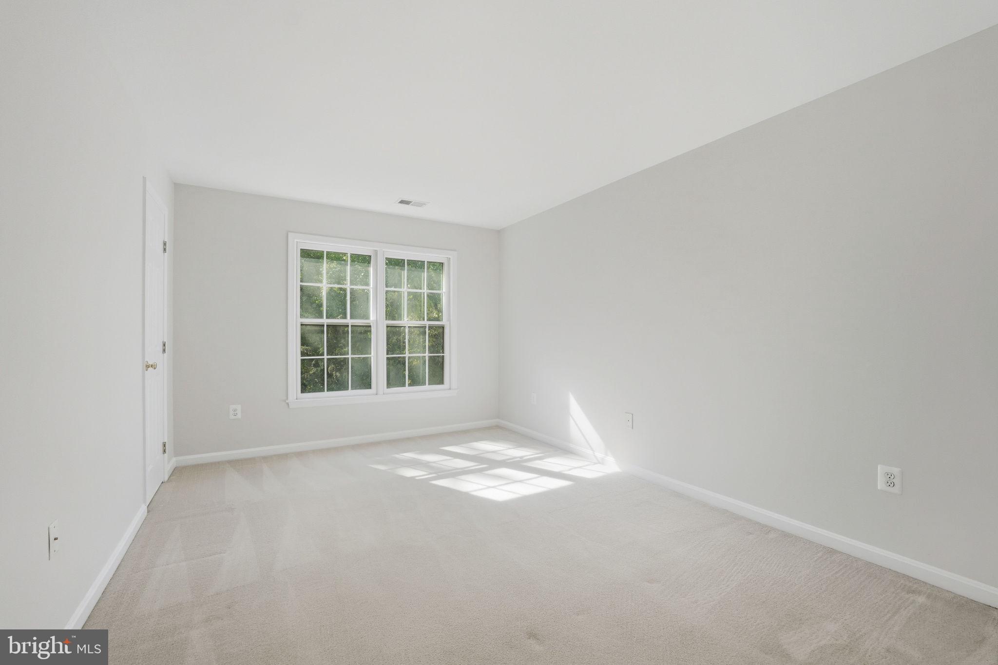 21507 Tithables Circle Broadlands, VA 20148 - Photo 28 of 64 a view of an empty room with a window