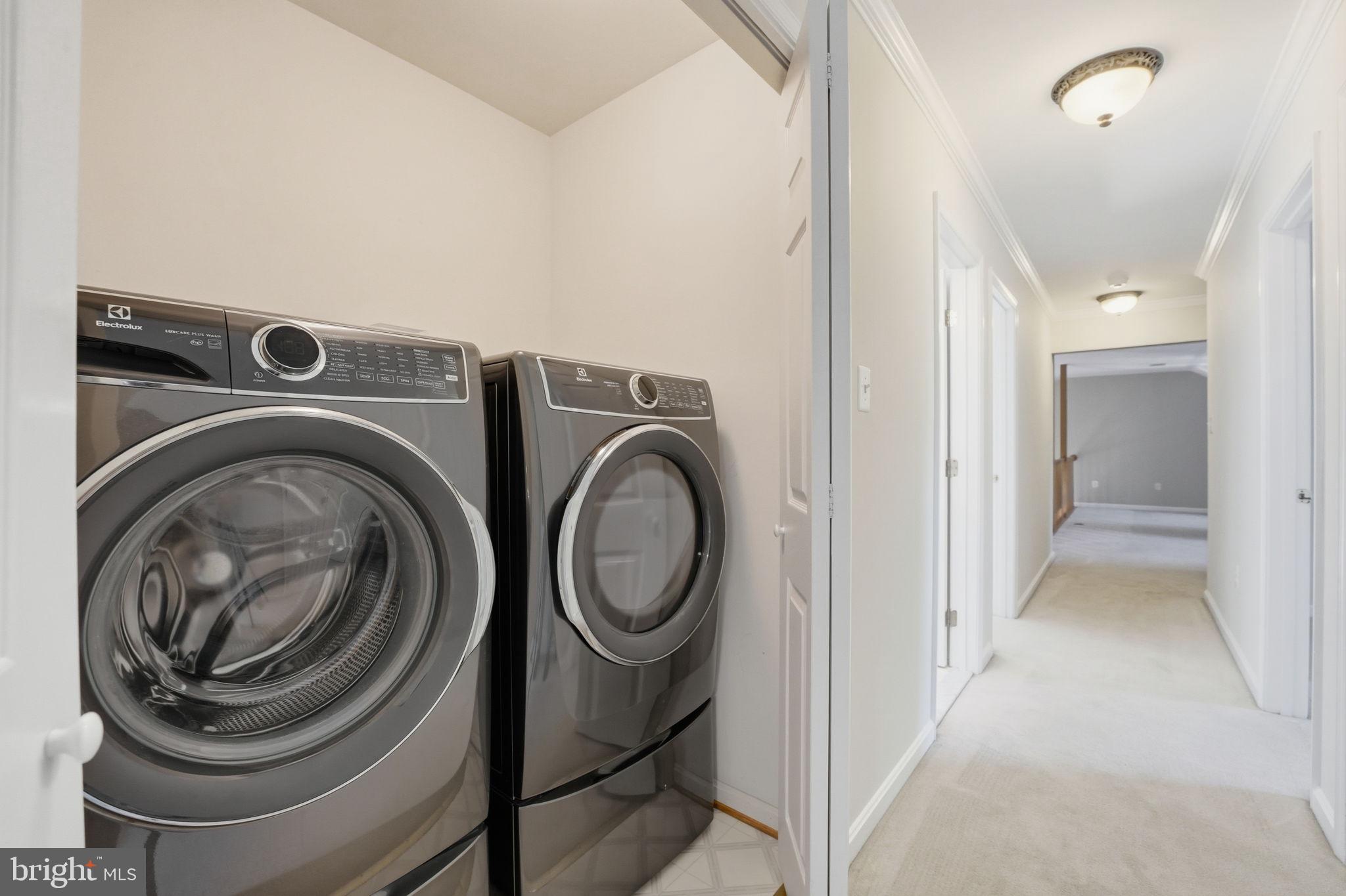 21507 Tithables Circle Broadlands, VA 20148 - Photo 34 of 64 a view of a hallway with washer and dryer