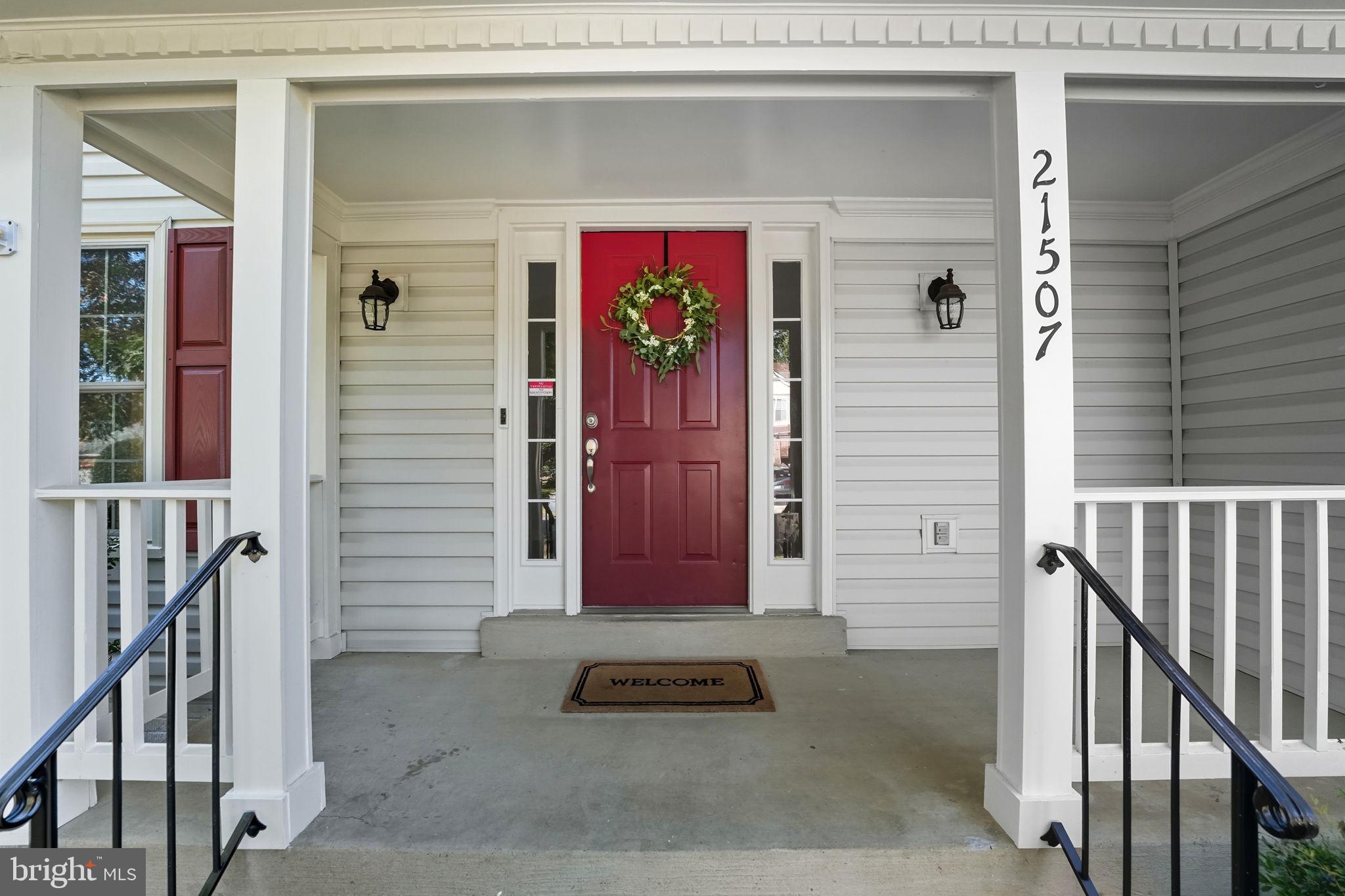 21507 Tithables Circle Broadlands, VA 20148 - Photo 4 of 64 a front view of a house with a door