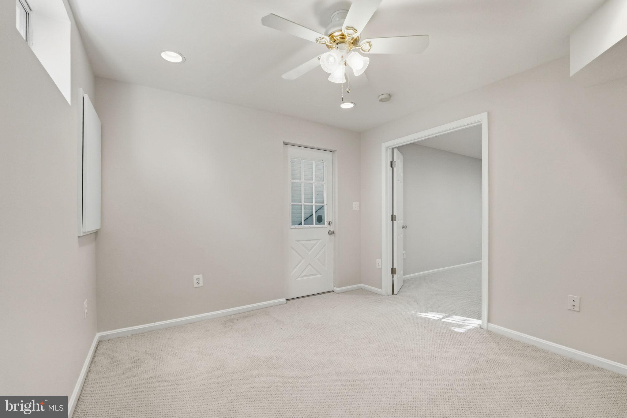 21507 Tithables Circle Broadlands, VA 20148 - Photo 46 of 64 an empty room with a ceiling fan and carpet