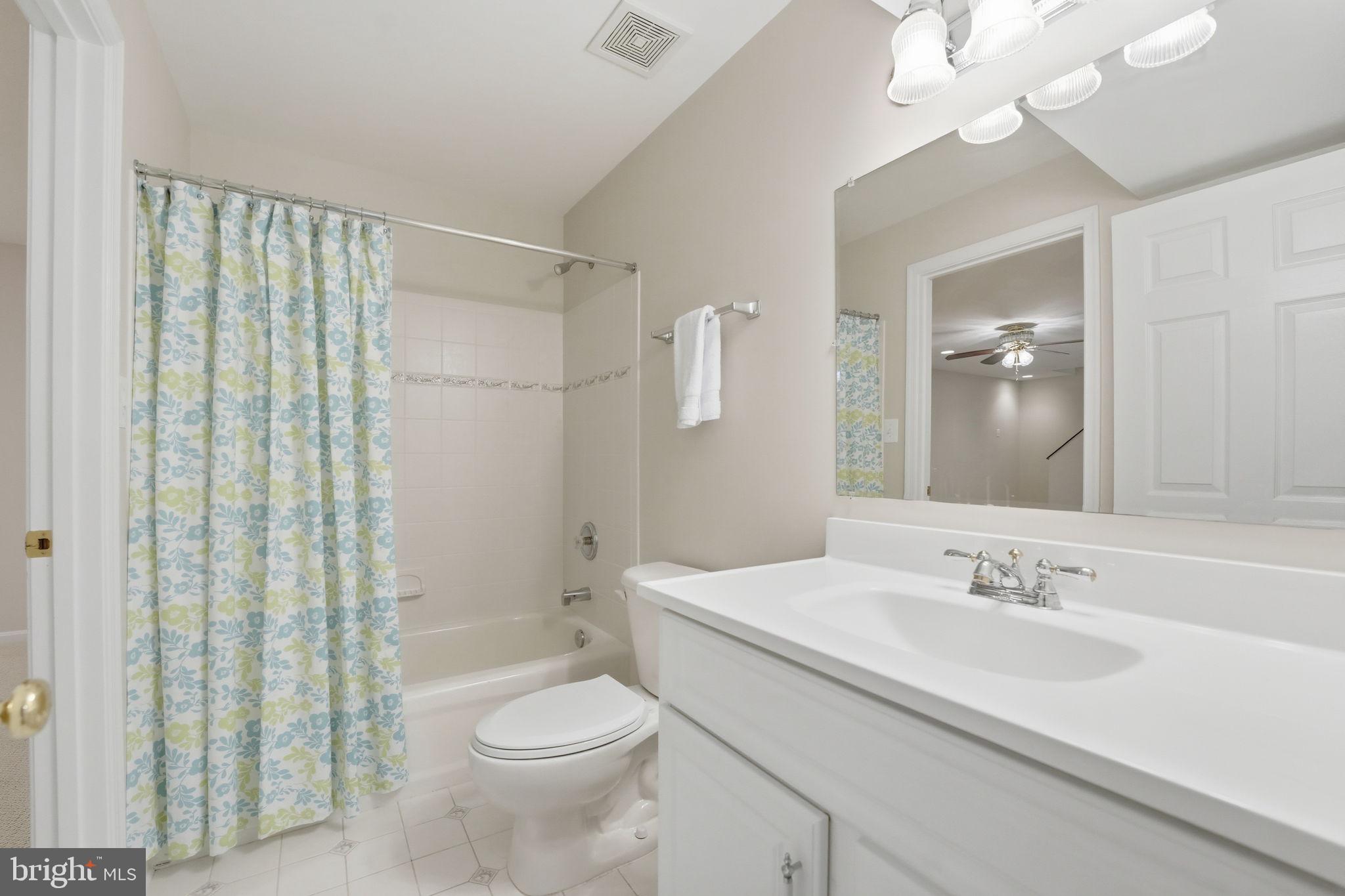 21507 Tithables Circle Broadlands, VA 20148 - Photo 47 of 64 a bathroom with a sink a toilet and shower