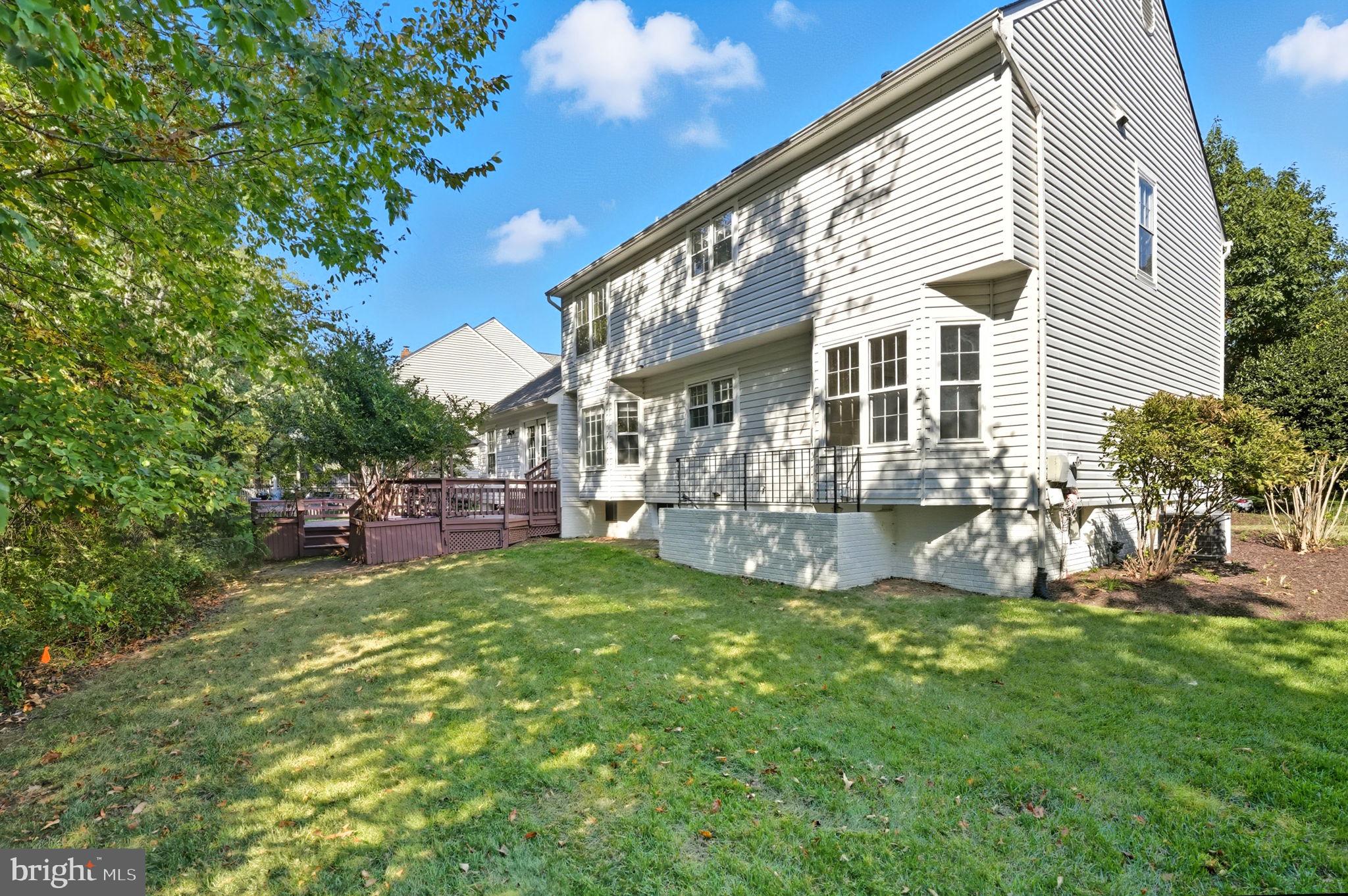 21507 Tithables Circle Broadlands, VA 20148 - Photo 55 of 64 a view of a house with a yard porch and sitting area