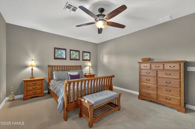 a bedroom with furniture and a lamp