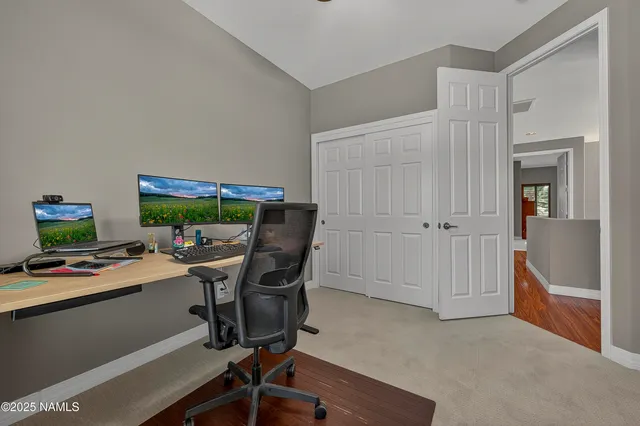 a view of a workspace with furniture and toys