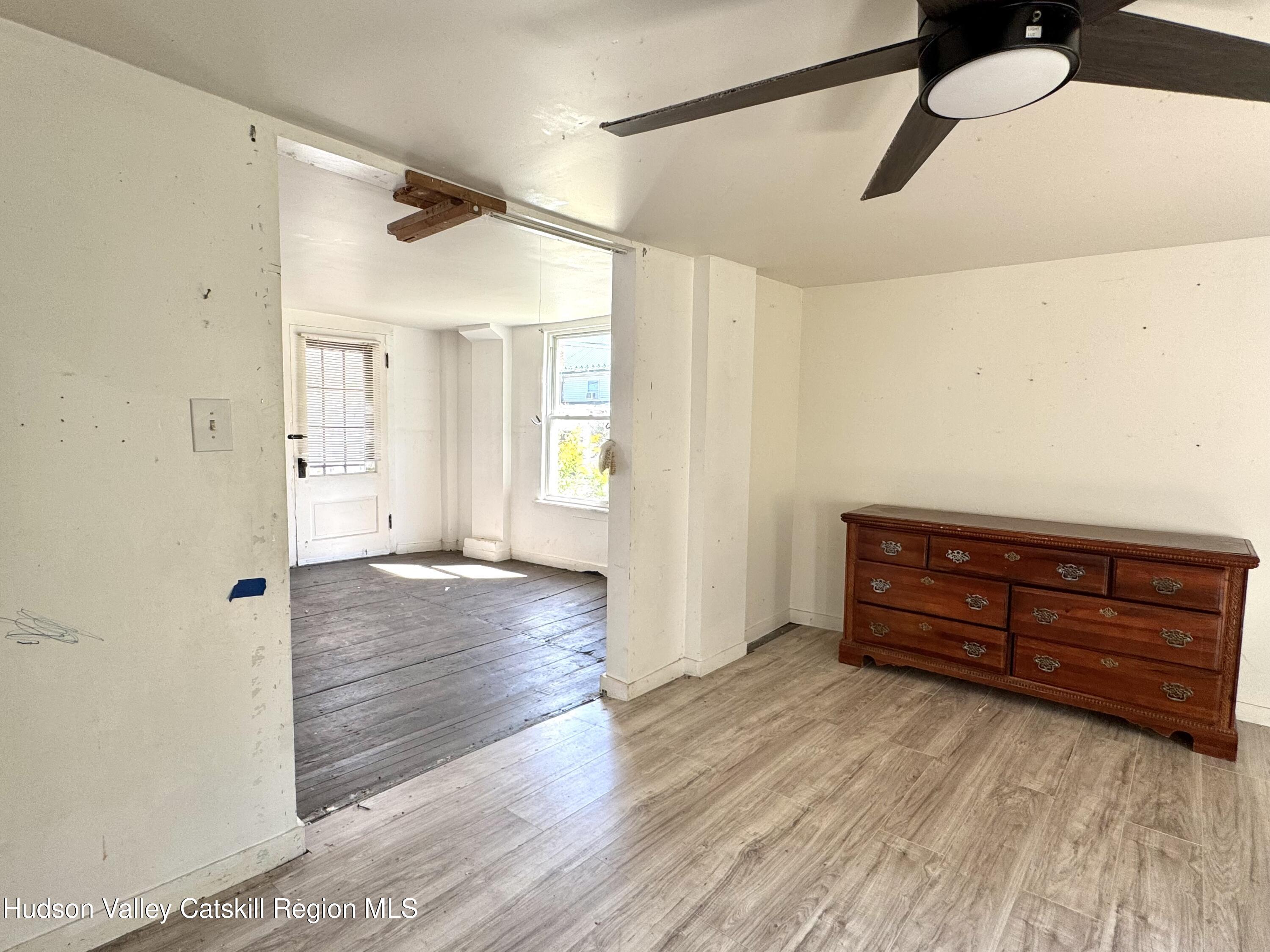 384 Highway 296 Windham, NY 12439 - Photo 11 of 26 a view of room with window and wooden floor