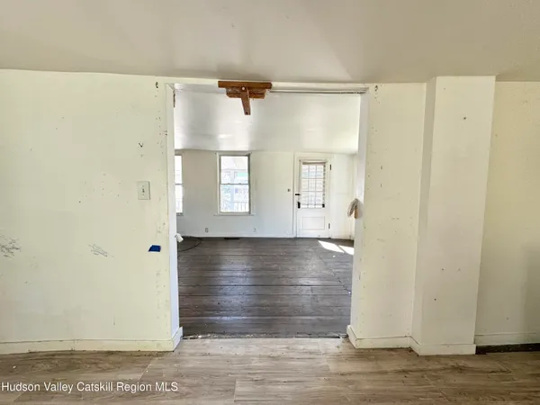 a view of bathroom with wooden floor