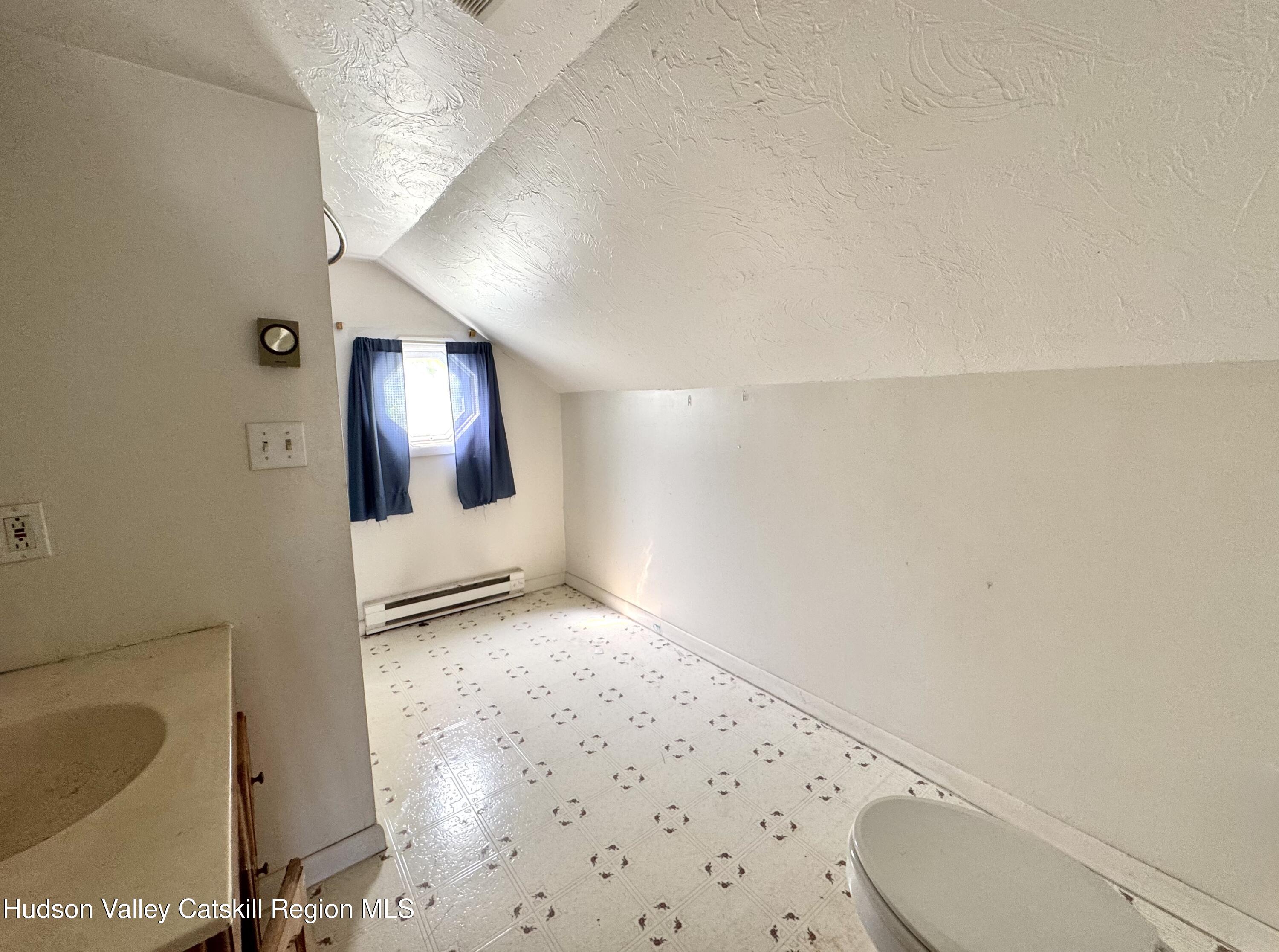 384 Highway 296 Windham, NY 12439 - Photo 18 of 26 a bathroom with a sink and a mirror