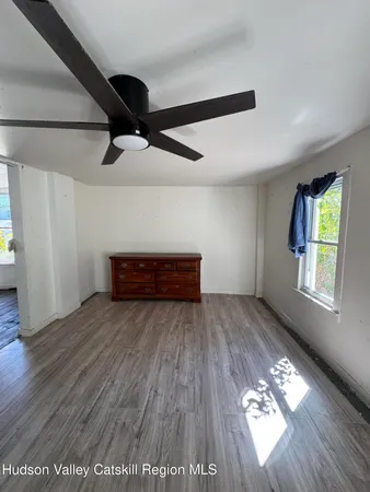 a view of wooden floor in an empty room