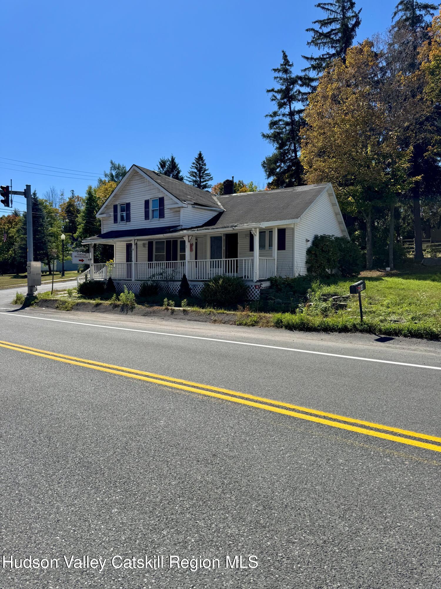 384 Highway 296 Windham, NY 12439 - Photo 3 of 26 a front view of a house with a yard