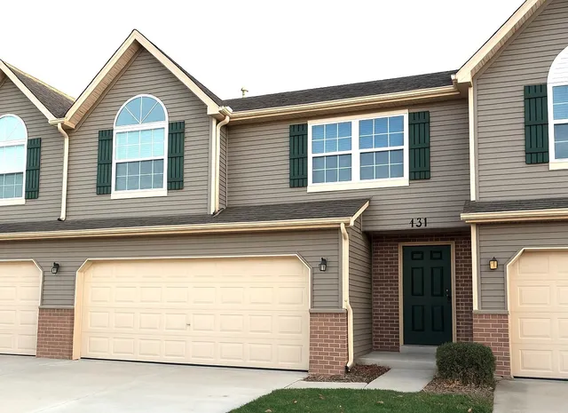 a view of a house with garage