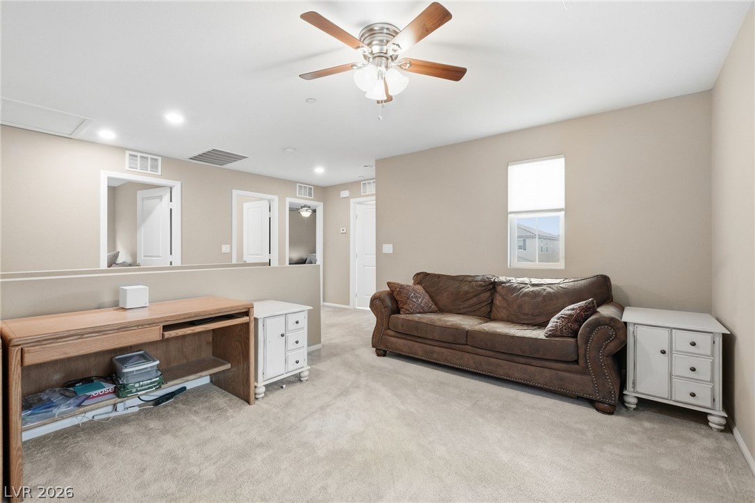 150 Fulgora Street Henderson, NV 89074 - Photo 38 of 92 Upstairs loft featuring light carpet, a ceiling fan, and recessed lighting