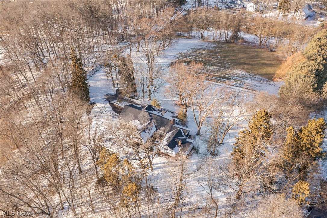 3151 Perry Drive Northwest Canton, OH 44708 - Photo 49 of 49 Snowy aerial view with view of wooded area