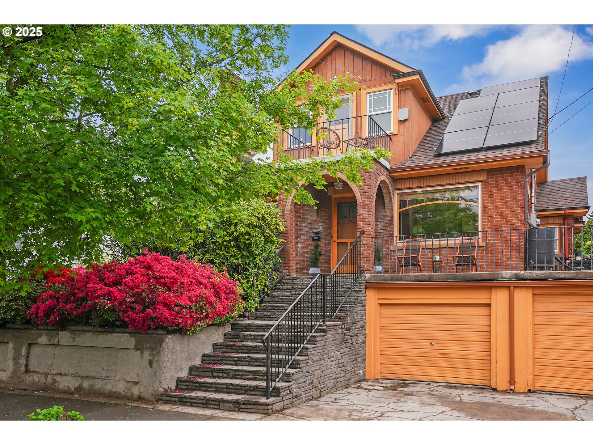 a front view of a house with garden