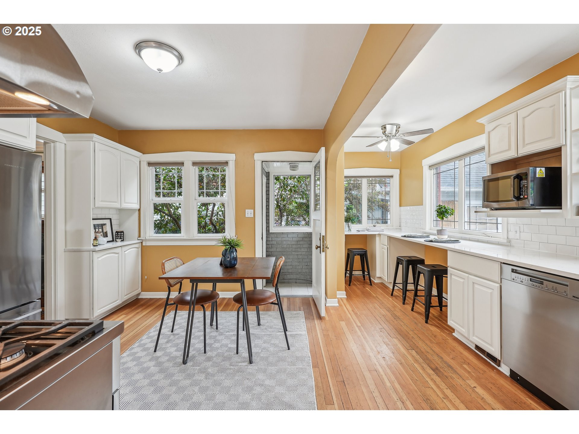 4324 Southeast 28th Avenue Portland, OR 97202 - Photo 12 of 42 a dining room with furniture and wooden floor