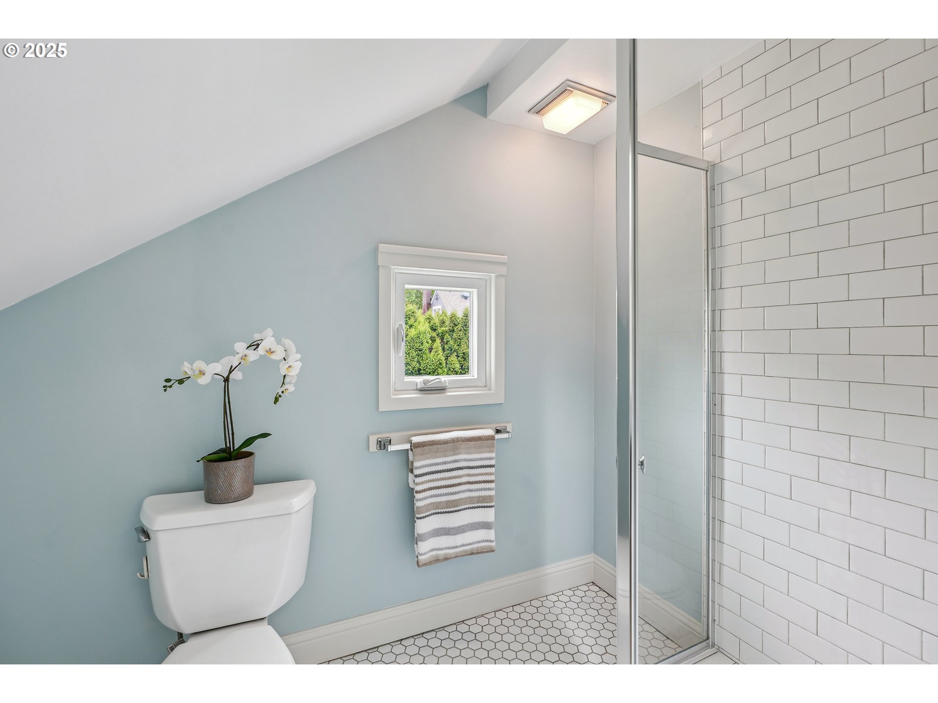 4324 Southeast 28th Avenue Portland, OR 97202 - Photo 23 of 42 a bathroom with a sink a toilet and mirror
