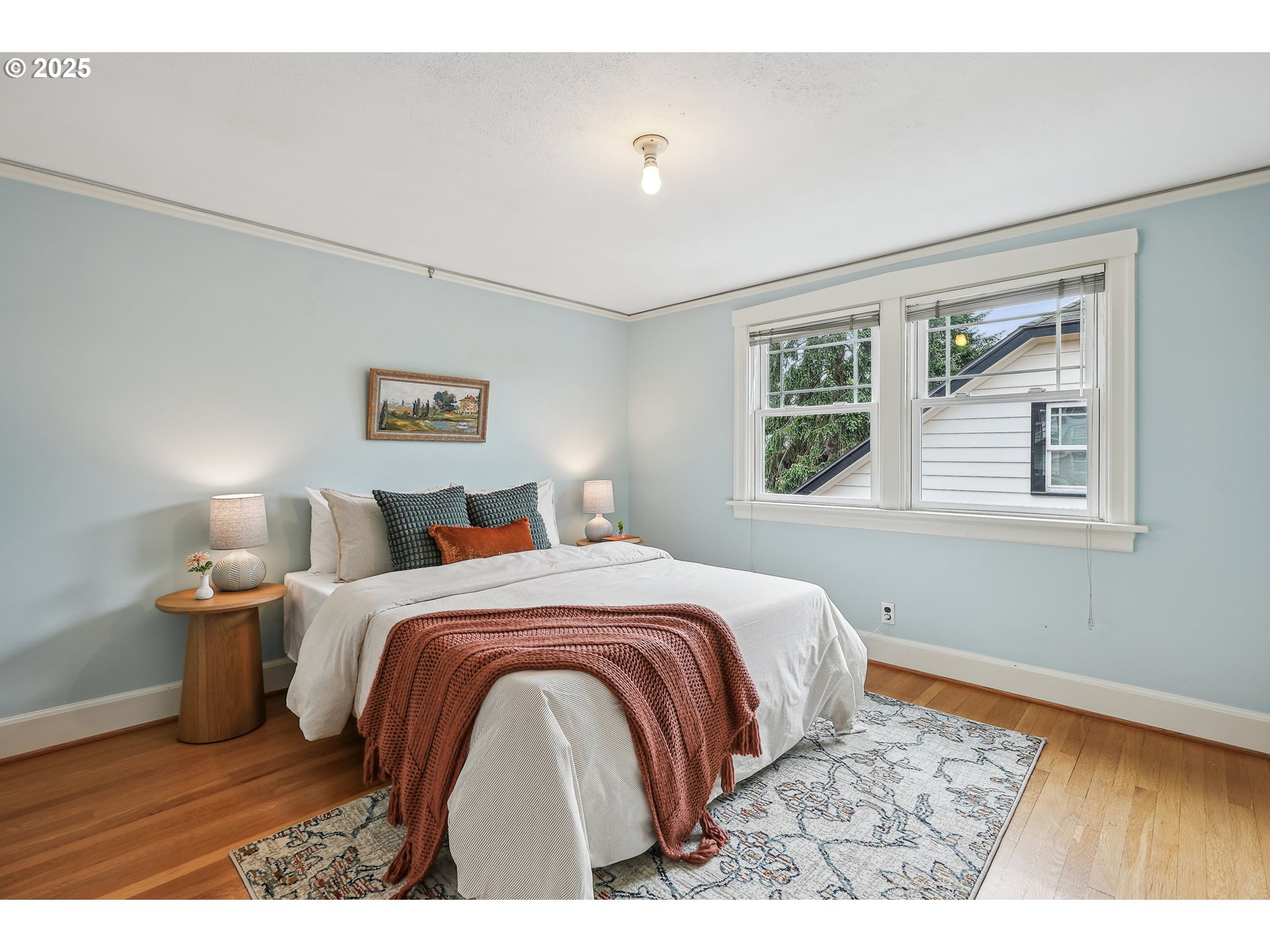4324 Southeast 28th Avenue Portland, OR 97202 - Photo 27 of 42 a bedroom with a large bed and a window