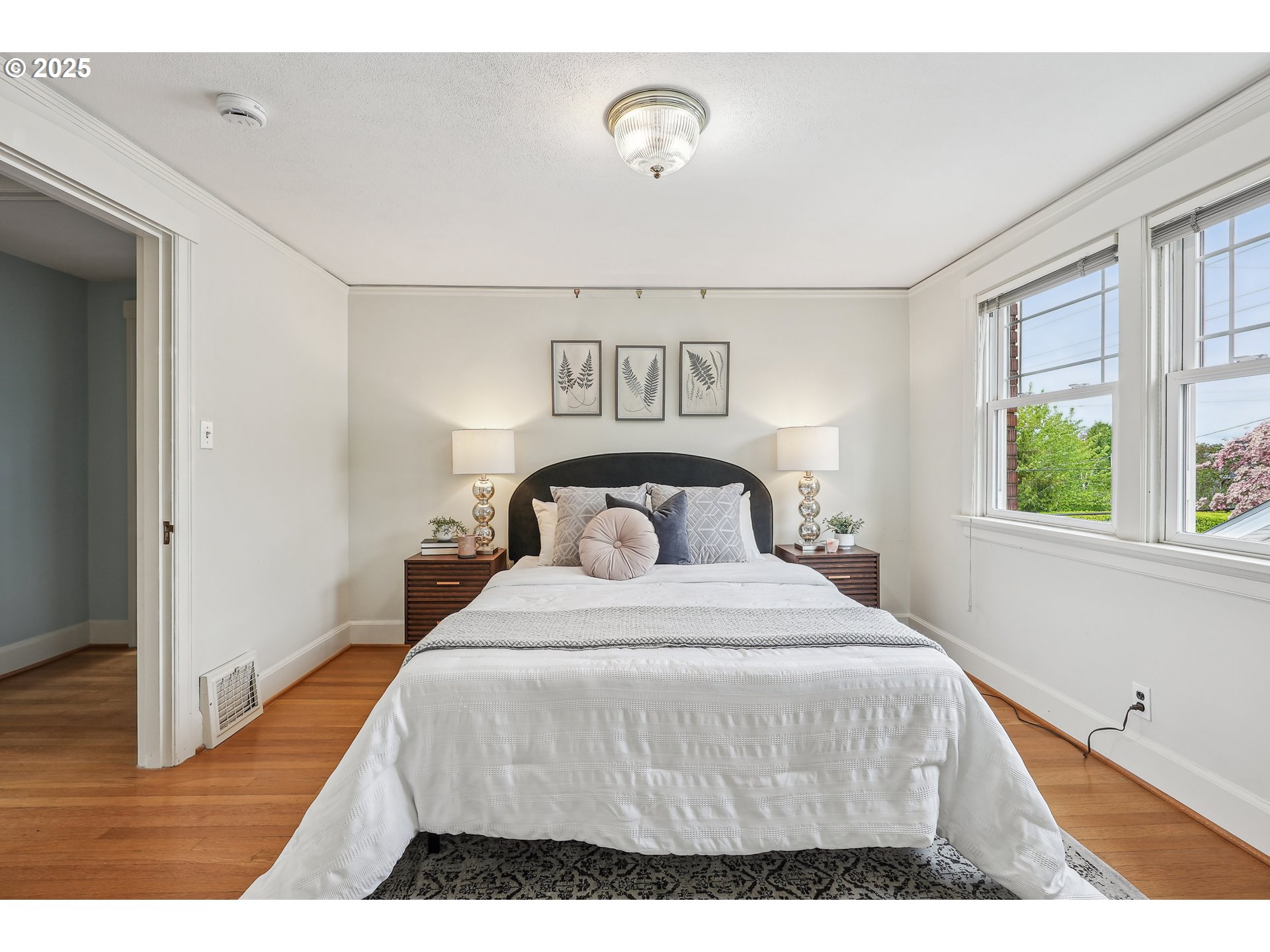 4324 Southeast 28th Avenue Portland, OR 97202 - Photo 30 of 42 a bedroom with a bed and window