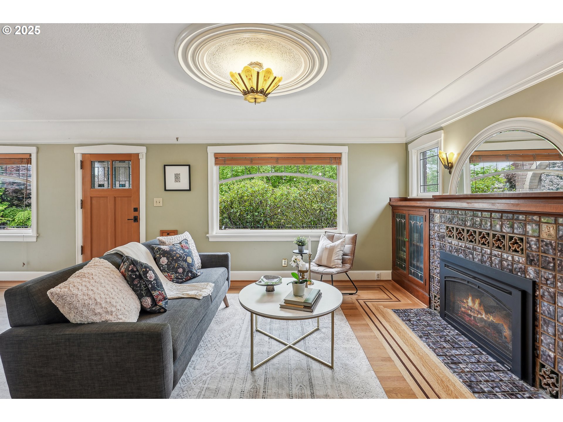 4324 Southeast 28th Avenue Portland, OR 97202 - Photo 5 of 42 a living room with furniture a window and a fireplace