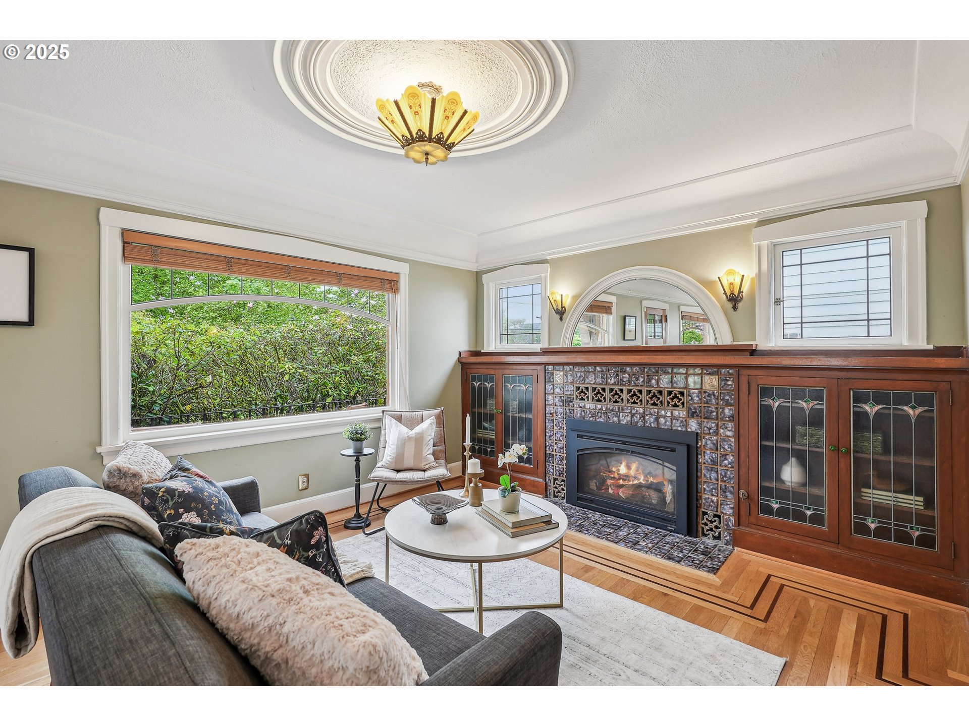 4324 Southeast 28th Avenue Portland, OR 97202 - Photo 6 of 42 a living room with furniture a fireplace and a large window