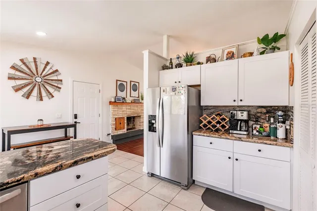 a view of living room with furniture and a potted plant