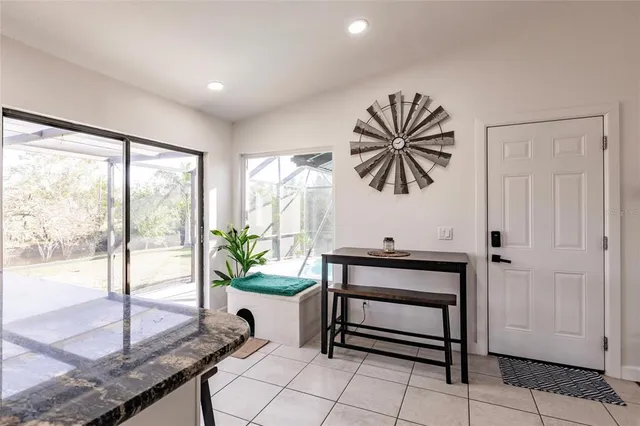 a living room with a bed furniture and a window