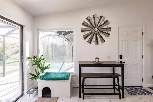 a bedroom with furniture and a flat screen tv