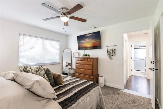 a bedroom with a bed and a couch