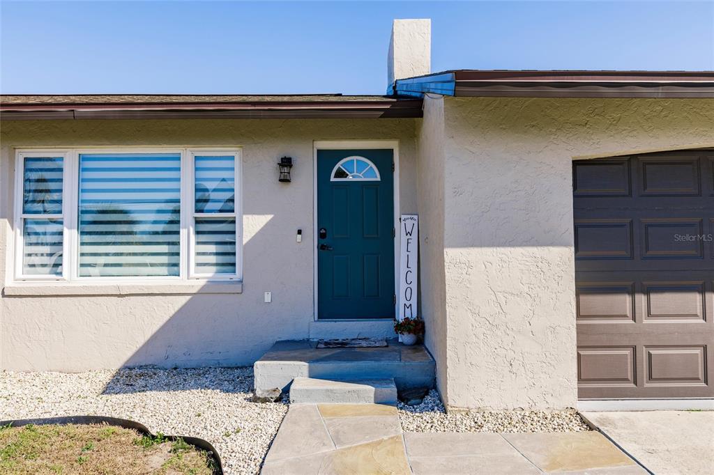 156 Danforth Drive Punta Gorda, FL 33980 - Photo 2 of 58 a bedroom with a bed and a window