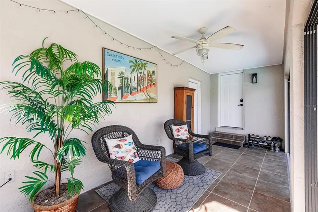a view of a lounge chair and table in the patio