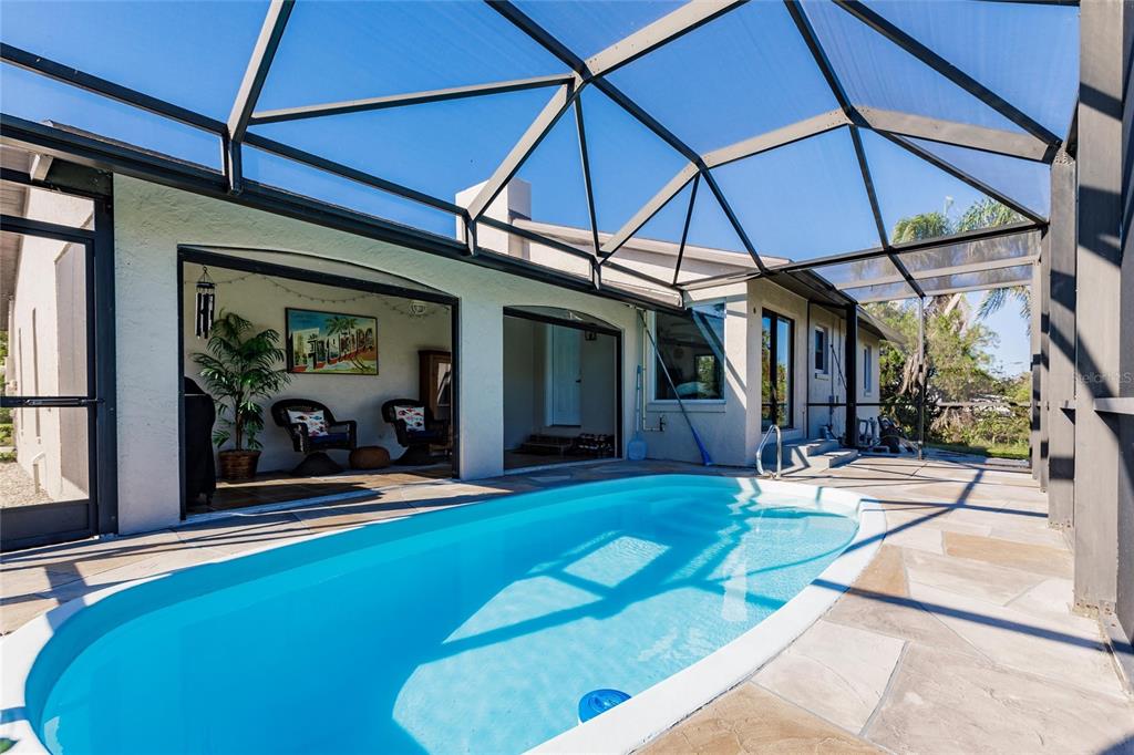 156 Danforth Drive Punta Gorda, FL 33980 - Photo 36 of 58 a view of a lounge chair and table in the patio