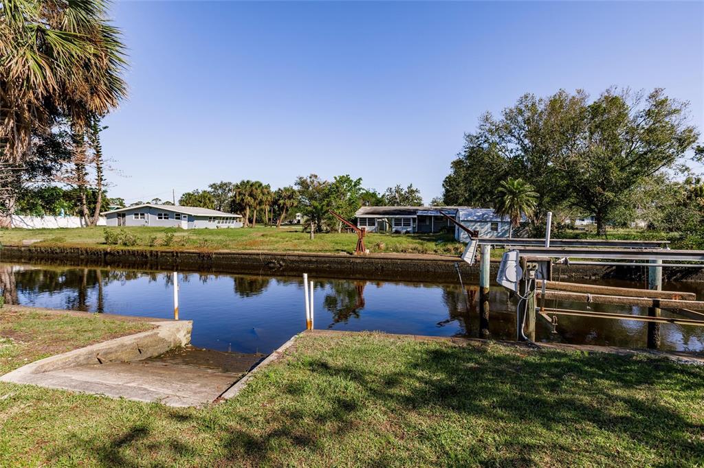 156 Danforth Drive Punta Gorda, FL 33980 - Photo 44 of 58 a view of a lake with a house