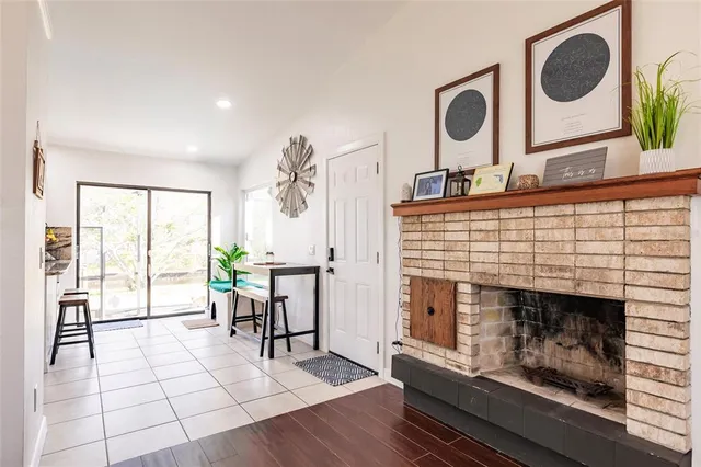 a kitchen with stainless steel appliances granite countertop a sink refrigerator and cabinets
