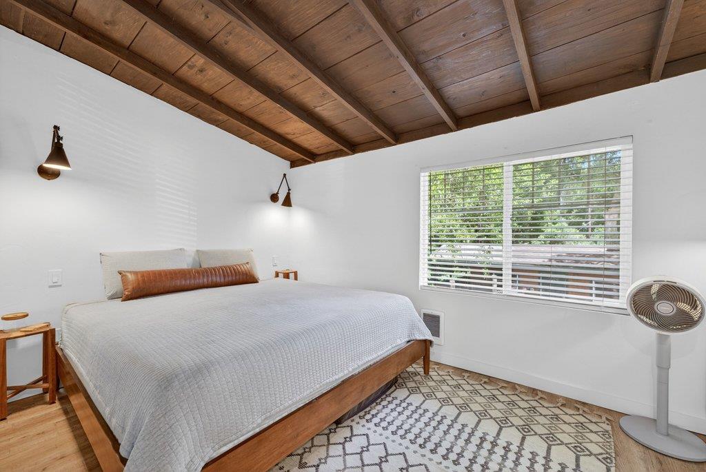 125 Shadowbrook Road Ben Lomond, CA 95005 - Photo 26 of 60 a bedroom with a bed and a window
