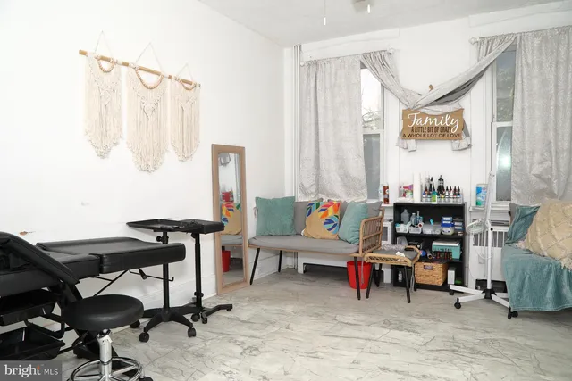 a living room with furniture and a rug