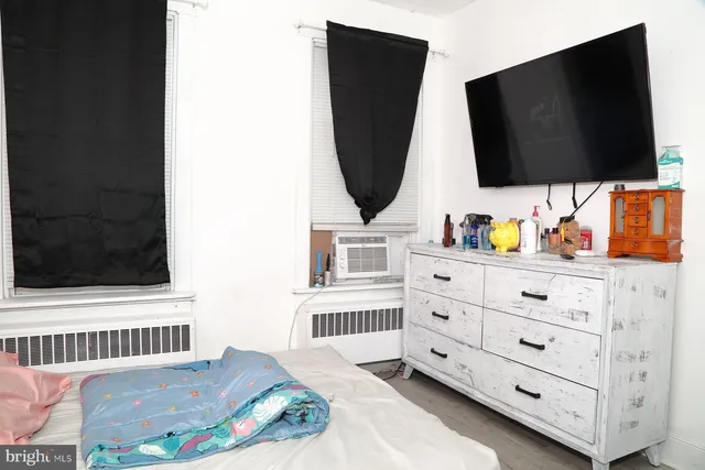 a view of living room with flat screen tv and lamp