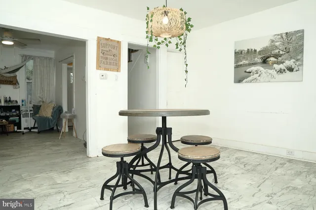 a view of a room with furniture and chandelier