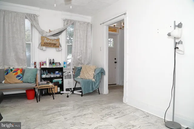 a living room with furniture and a window
